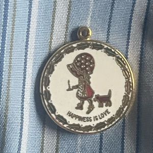 Holly Hobbie 1970’s gold tone and enamel round disc charm